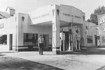 Delbert Taylor stands in front of the old Standard Oil station